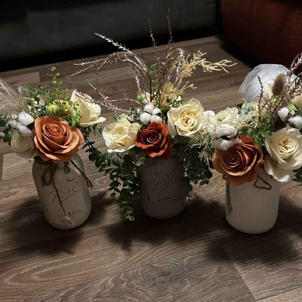 9 mason jars with flower decorations